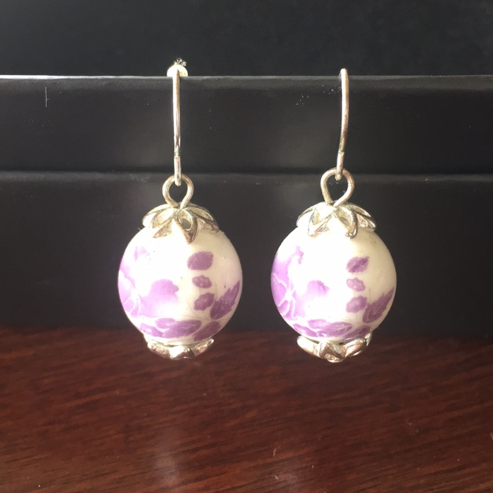 Unique lavender color floral globe earrings.